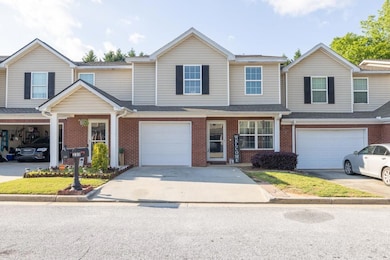 Townhome / multi-family property with a garage, br