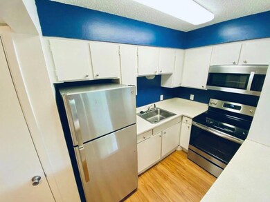 Kitchen featuring appliances with stainless steel