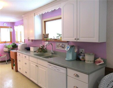 updated kitchen with solid surface counter tops