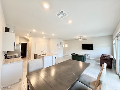 Dining space featuring light tile patterned floors