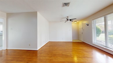Another view of the living room with classic hardw