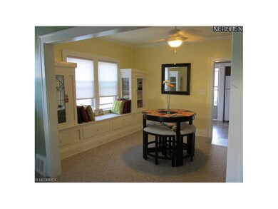 11 x 13 Dining Room with built in window seat and cabinets.