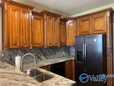 Upgrades with granite, sink  and has nice bar area with eat in kitchen