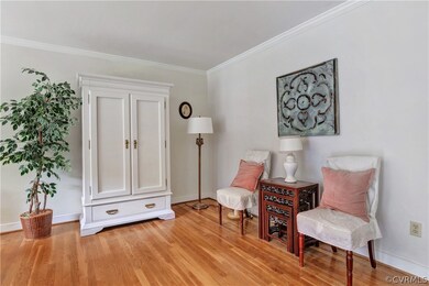 Spacious living room with wood floor and a large b