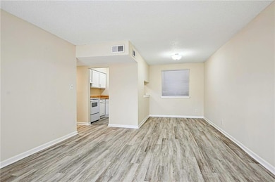 Living room, Dining area and entrance to Kitchen.