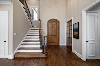 Foyer entrance featuring dark hardwood / wood-styl