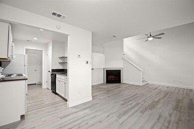 Kitchen with open floor plan, light wood-style fl
