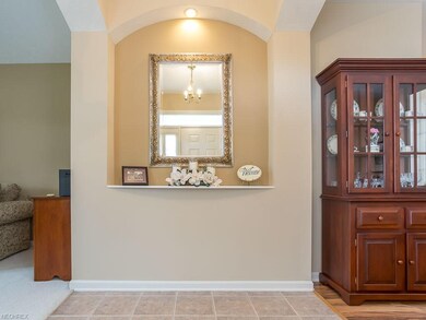 Inviting split entry way with decorative niche fla