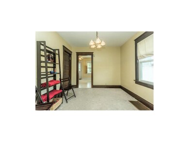 Off the formal dining room is the delightful, full