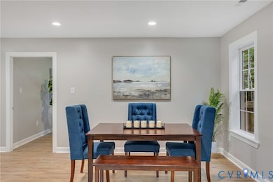 Dining area featuring light wood-style flooring and recessed lighting