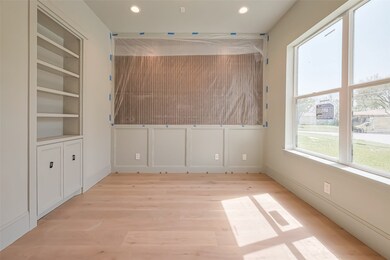 Stylish home office with custom wall paneling. Pho
