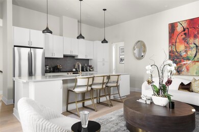 Kitchen featuring decorative backsplash, an islan