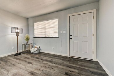 Living room with laminate flooring, all new paint,