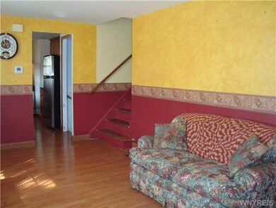 Living Room. Stairway from living room leads to le