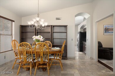 Dining Area, Entry to Kitchen and Den