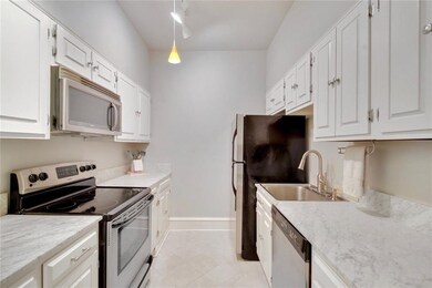 Stone counters, stainless steel appliances and ref
