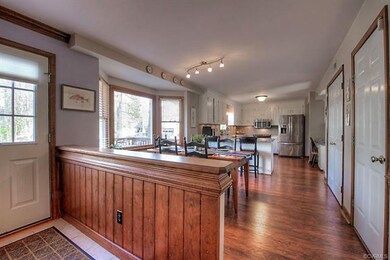 View to open eat in kitchen with: New floors, lighting, granite counters, back splash and all appliances convey