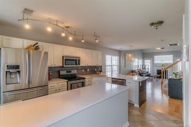 Unique kitchen renovation with quartz counters, gl