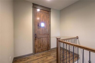 Front foyer. Beautiful wooden front door.