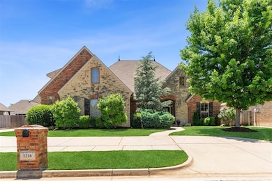 Tudor home featuring brick siding