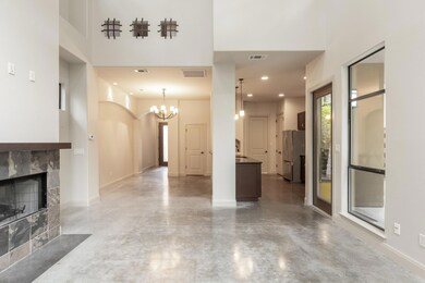 Unfurnished living room with concrete floors, a t