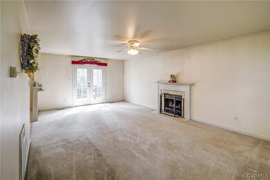 Family room has gas fireplace, and garden doors to