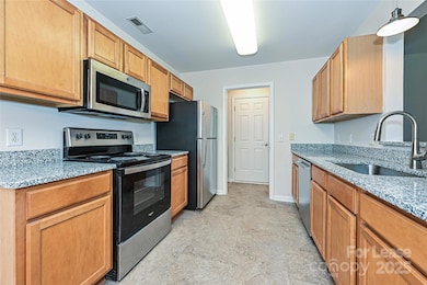 Kitchen leading to 2 Car Garage through Laundry area.