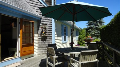 Large Mahogany deck w/access to Living room on left.