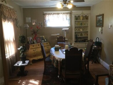 DINING ROOM HAS A CORNER HUTCH