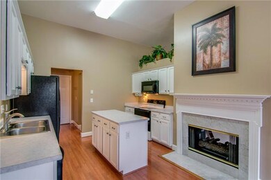 The fireplace is shared by the kitchen/eat-in as well!