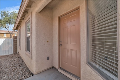 Property entrance with stucco siding