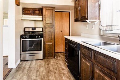 Stainless steel gas stove and dishwasher have been added to this space.