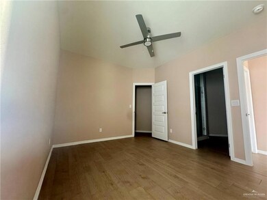 Unfurnished bedroom featuring baseboards and wood finished floors