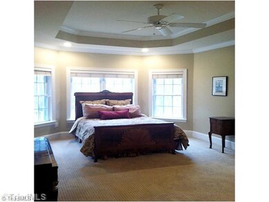 Master Bedroom. Relax at the end of the day in the oversized Master Bedroom with Sitting Area.  A tray ceiling completes the picture of this exquisite room.