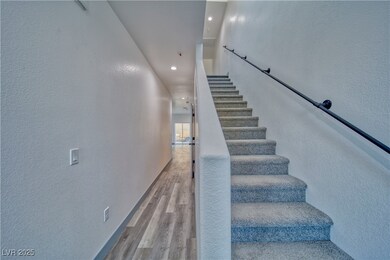 Entryway with vaulted ceilings and plush carpeted
