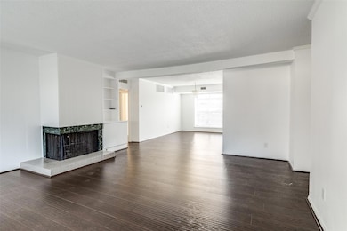 Unfurnished living room featuring an inviting chan