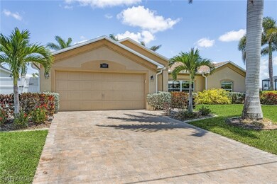 View of front of house with stucco siding, decorat