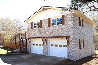 View of front of property with brick siding, drive