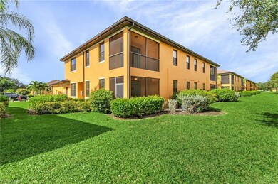 Back of property featuring a lawn