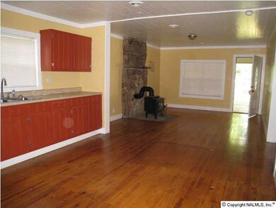 another view of living room from eat in kitchen area