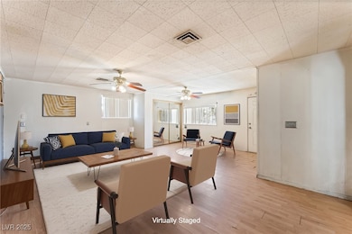 Living room featuring light wood finished floors a