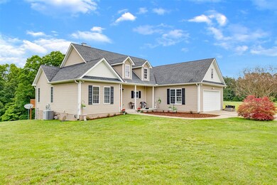Covered porch and lush landscaping