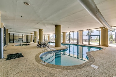 View of swimming pool with a lanai and a patio are