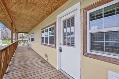 This photo showcases a charming covered porch with