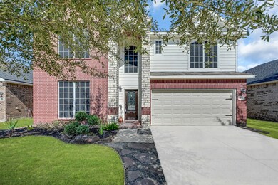 Two story elevation with stone and brink