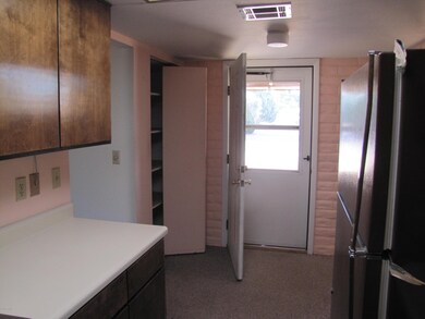 Door from kitchen to carport