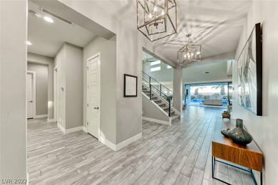 Wide, open entry way with wood-like tile floors &
