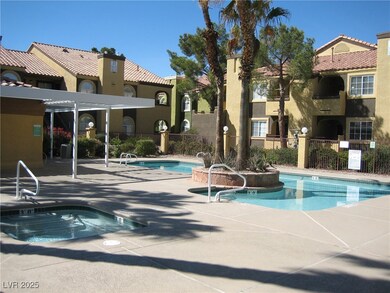 Community pool with fence and a patio