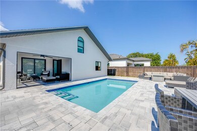 View of swimming pool with ceiling fan, a patio ar