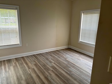 Empty room with light wood-type flooring